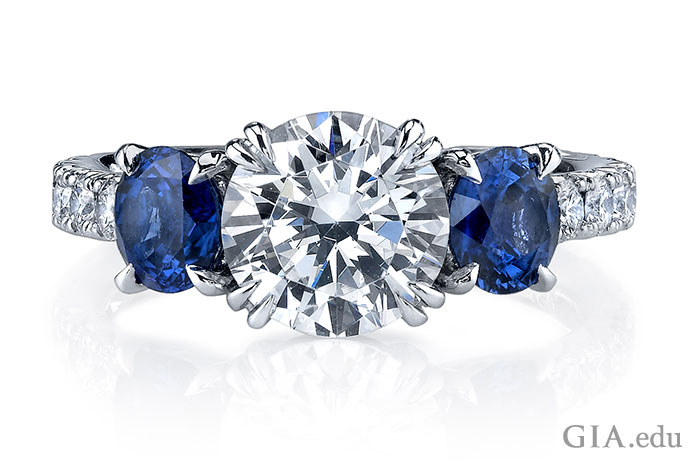 A diamond and sapphire three stone engagement ring.