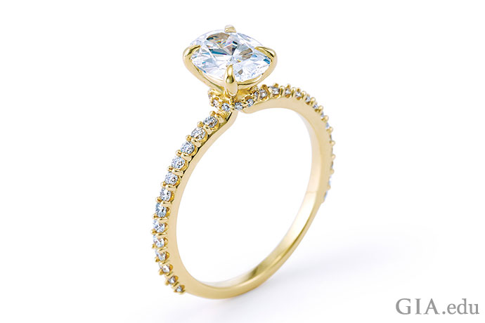 A gold diamond engagement ring.