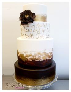 Elegant wedding cakes with four tiers. Write your vows across your cake in gold!