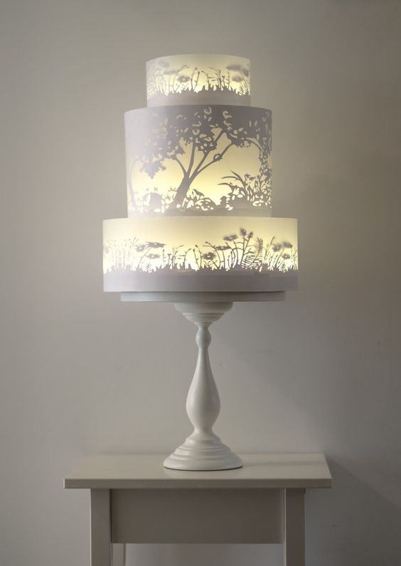 The glowing tiers of this wedding cake appear to be lit from within. Very clever painting by Rosalind Miller.