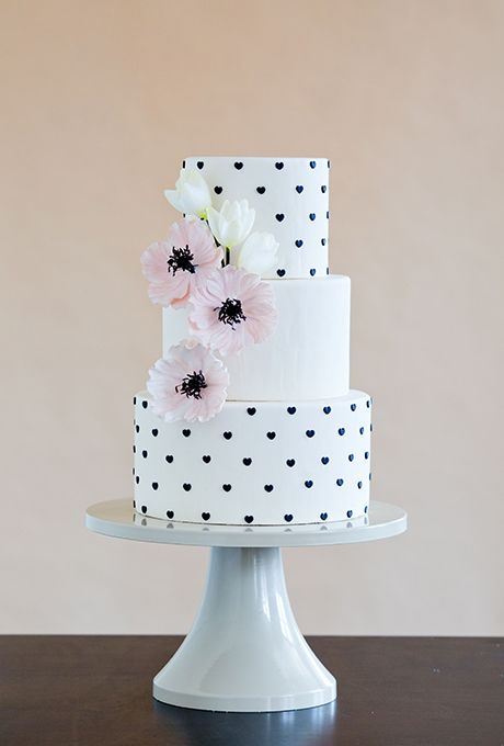 Instead of Swiss dots or polka dots, cake designer Erin Gardner of Wild Orchid Baking Co. decorated the tiers with tiny fondant hearts, which gives the design a preppy-yet-whimsical feel. Photography: Mark Davidson.
