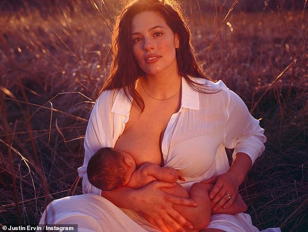 Aww: Ashley looked angelic as she breastfed their son Isaac in a field
