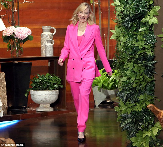 Bright spark: The actress certainly stood out for the talk show appearance in a neon pink Edun pantsuit