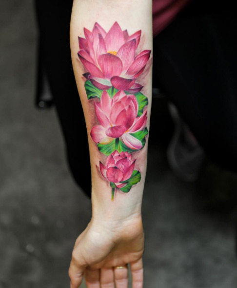 Lotus flowers on forearm by Mikhail Anderson