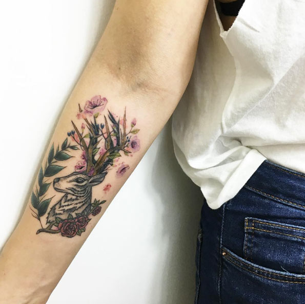Floral stag piece on forearm by Faith Odabas