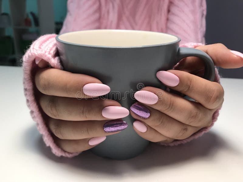 Pink nails with glitter in autumn or winter time royalty free stock image