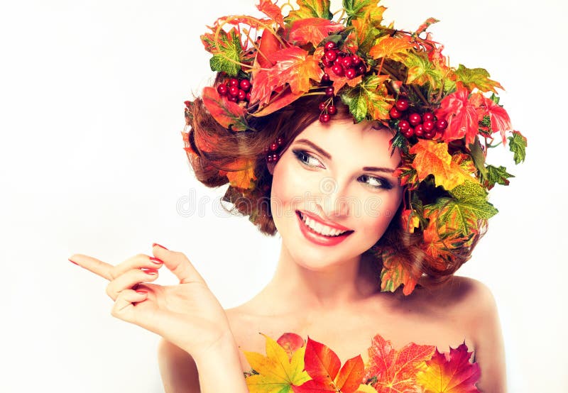 Red and yellow autumn Leaves on girl head. Autumn Beauty - fashion Makeup With Red and yellow autumn Leaves on girl head . Emotions and surprise on the face of royalty free stock photography