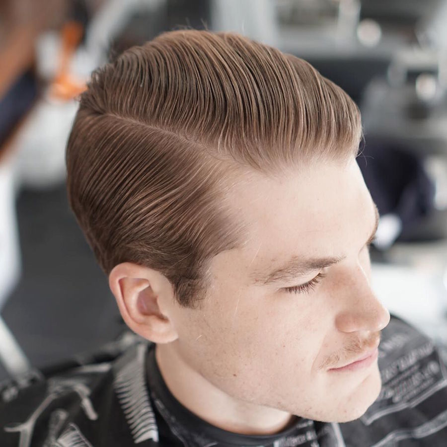 Classic slicked back hairstyle for men in medium length of hair