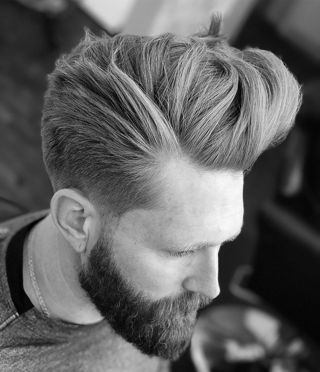 Cool long pompadour hairstyle for men with shaved sides